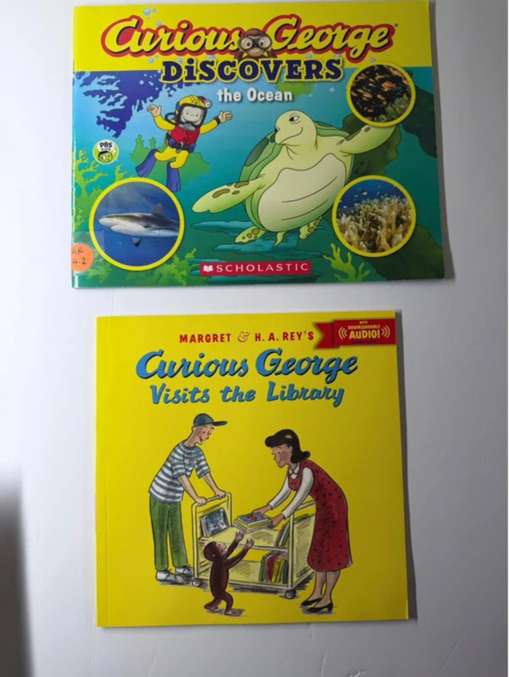 Lot of 2 Curious George Childrens Books Discovers the Ocean Visits the Library